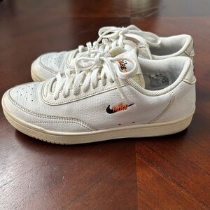 Nike White Sneakers with Black and Orange Accents vintage
